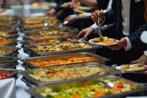 people group catering buffet food indoor in luxury restaurant with meat colorful fruits and vegetables